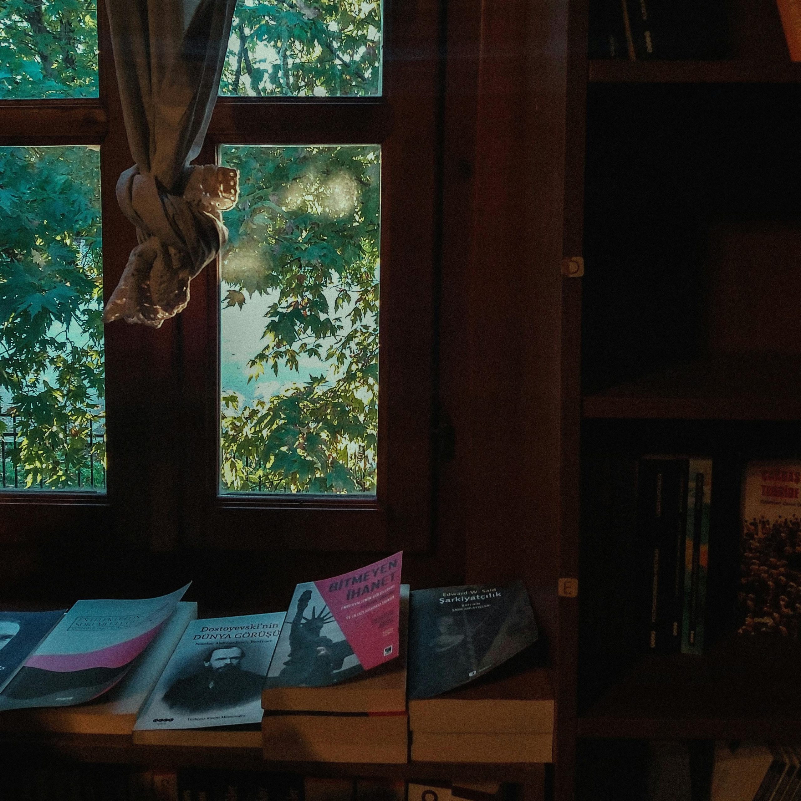 The image displays cozy reading place with books on table.